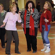 Singers Kim Inch, Renie Thompson and Jeanette Arsenault rehearse their song "This Is My Canada" for the Olympic Torch Relay event in Picton, Ontario, Canada.